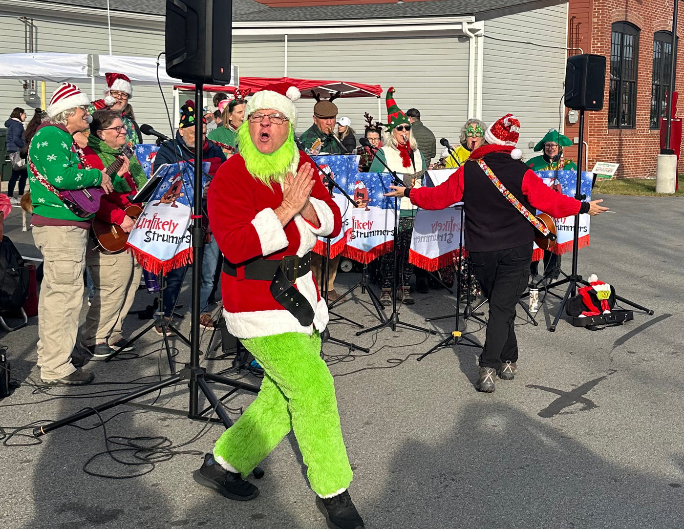 The Grinch dancing with the band