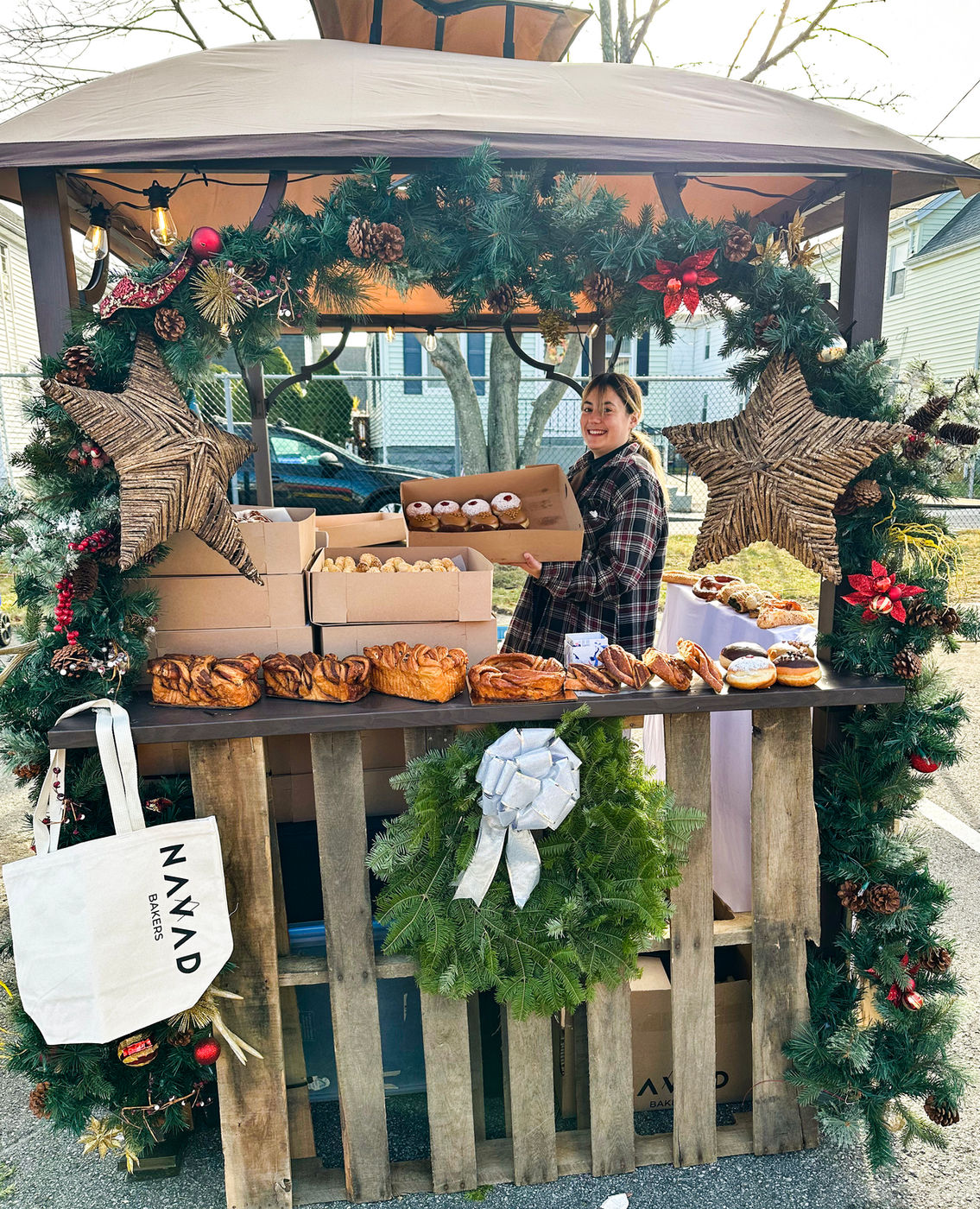 A vendor hut hung with wreaths